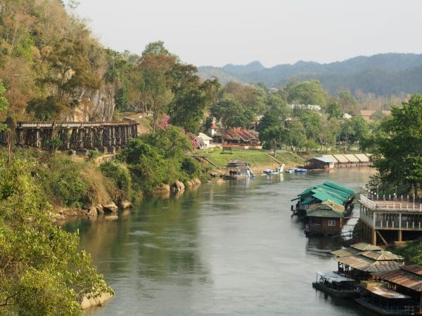 a river with boats and buildings