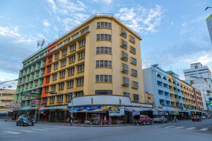 a large yellow building sitting on the corner of a street