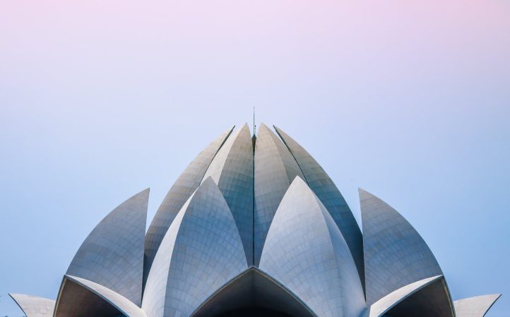 Stunning low angle view of the iconic Lotus Temple in New Delhi, showcasing its unique architectural design.