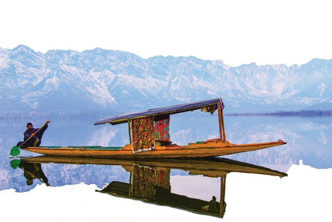 A vibrant shikara on Dal Lake with the stunning Himalayan backdrop, perfect for travel exploration.